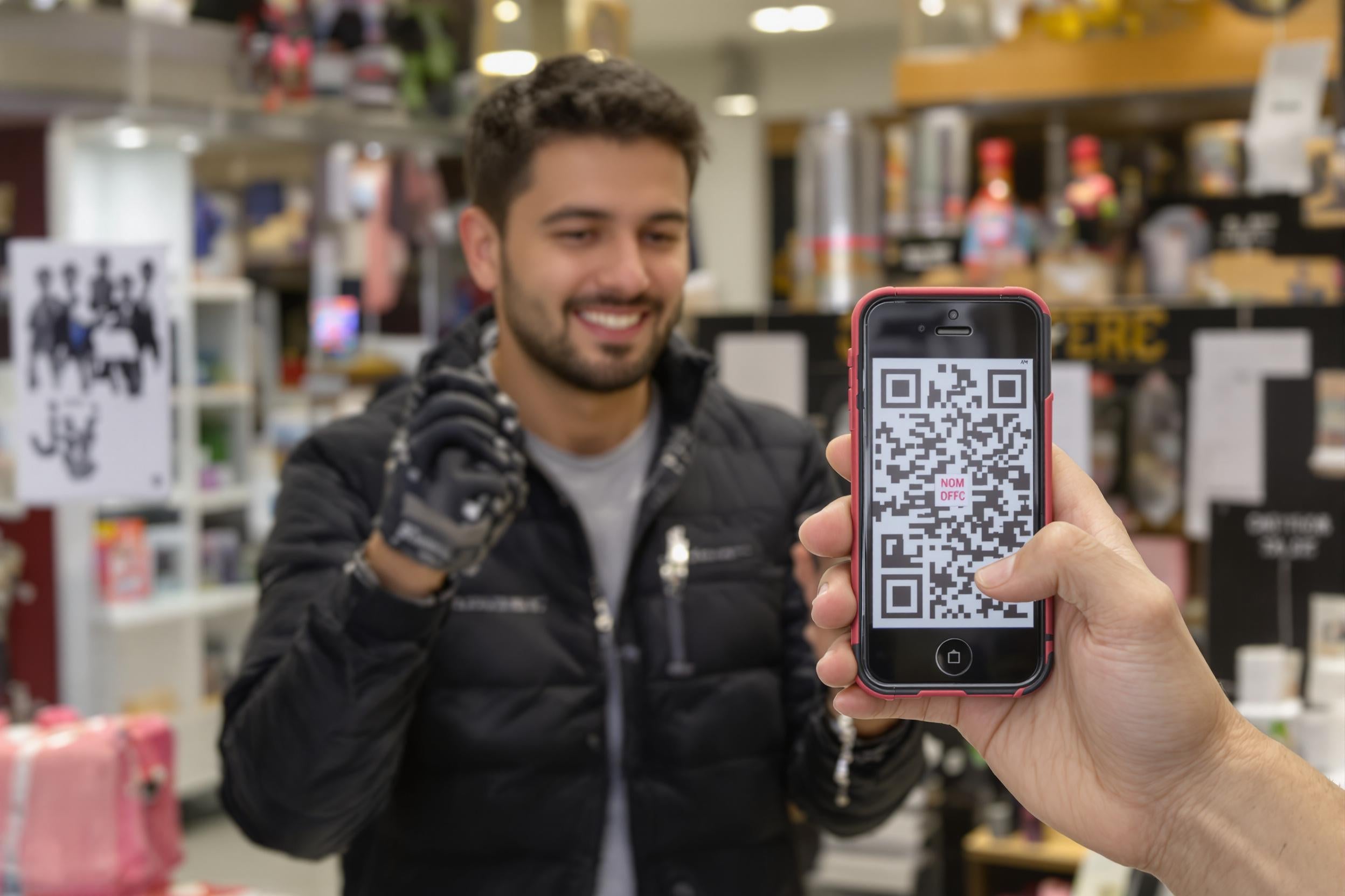 Customer scanning a QR code in store
