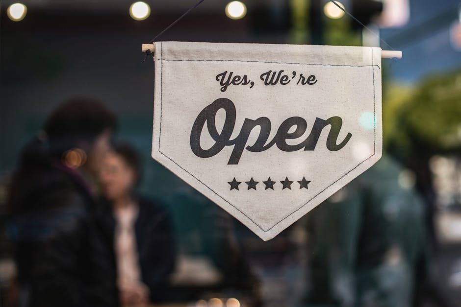 Enseigne lumineuse 'Welcome' dans une vitrine de magasin avec arrière-plan flou